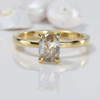 18ct gold oval cut salt and pepper diamond solitaire engagement ring on grey background