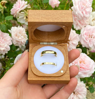 Two 18ct gold wedding rings in a box