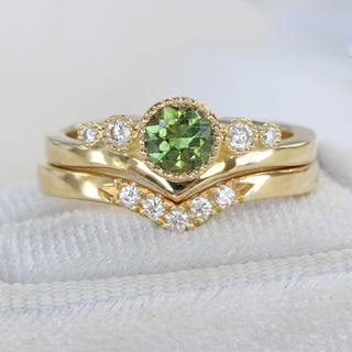 Green sapphire and diamond wishbone engagement ring presented in a handmade ring box.