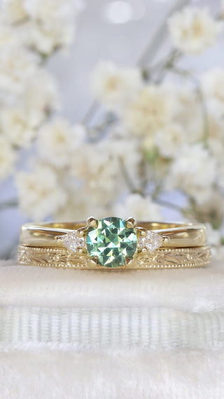 18ct gold Green sapphire and pear cut diamond trilogy engagement ring and slim orange blossom hand engraved wedding band