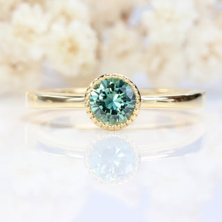 Custom Teal Green Sapphire Solitaire Engagement Ring in 18ct Gold