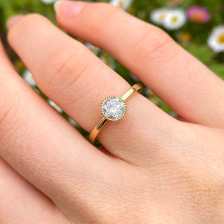 18ct gold salt and pepper diamond solitaire ring shown worn on hand.