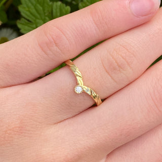 18ct gold leaf-engraved wishbone ring with fair trade Canadian diamond, worn on hand