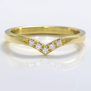 18ct gold wishbone wedding band with pave set diamonds at the front
