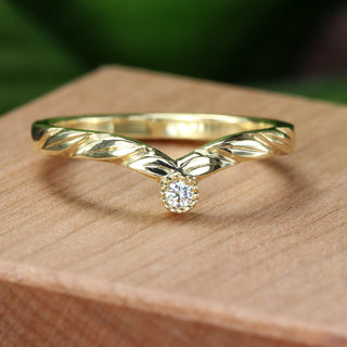 18ct gold wishbone ring with Canadian diamond shown on Lilia Nash ring box