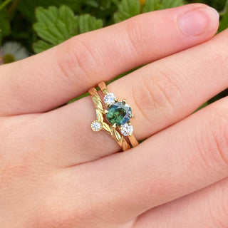 Gold wishbone ring stacked with sapphire engagement ring for styling inspiration