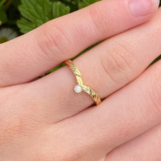 18ct gold leaf-engraved wishbone ring with fair trade Canadian diamond, worn on hand