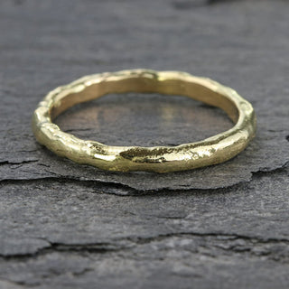 Unusual slim 18ct gold wedding ring with molten texture