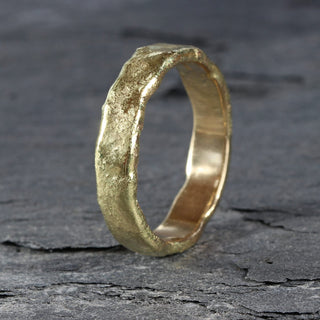 Molten textured 18ct gold wedding band for men. Handmade in Cornwall by Lilia Nash