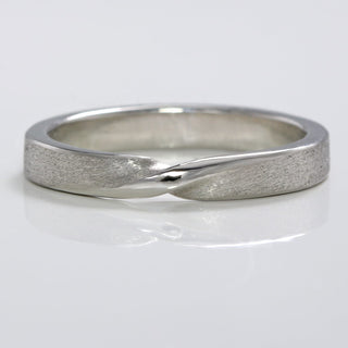 3mm wide Platinum ribbon twist wedding band with spun silk texture