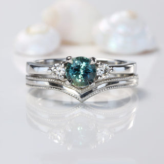 teal sapphire and diamond trilogy engagement ring and milgrain edge platinum wishbone wedding ring