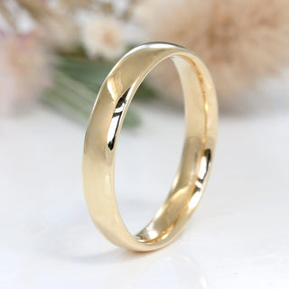 9ct gold 4mm court mens wedding band on white background