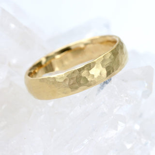 9ct gold 4mm court mens wedding band with hammered finish on white background