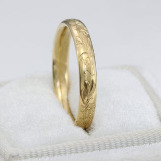 9ct gold 3mm court wedding band with hand engraved bluebells pattern in a velvet white box