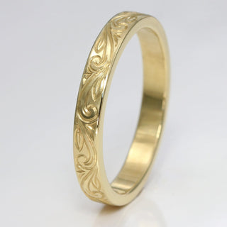 9ct gold wedding band with hand engraved floral scroll pattern