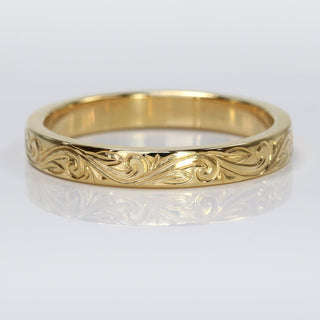Hand engraved floral scroll wedding ring in solid 9ct gold, with a 3mm flat profile