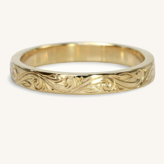 Hand engraved floral scroll wedding ring in solid 9ct gold, with a 3mm flat profile