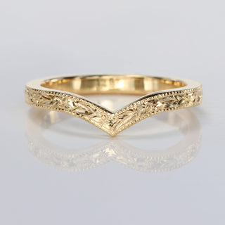9ct gold wishbone wedding ring with hand engraved orange blossom pattern on a white background