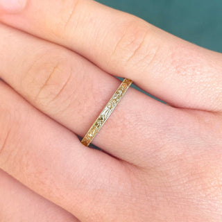 9ct gold slim wedding band with hand engraved orange blossom pattern, worn on the hand