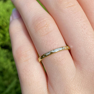 9ct gold slim hammered wedding band set with 20 diamonds, worn on the hand