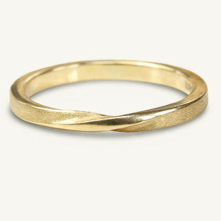 Handmade 9ct gold ribbon twist wedding band with spun silk finish 