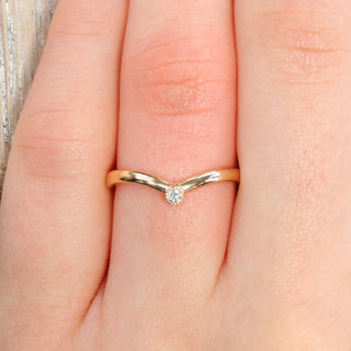 9ct gold diamond solitaire wishbone wedding ring worn on the hand