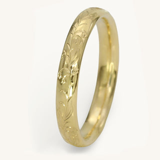 Hand engraved Bluebells pattern on a 18ct gold 3mm court wedding ring