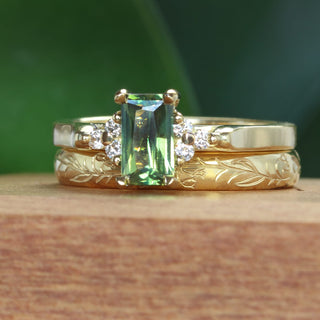 18ct gold Emerald cut green sapphire and diamond engagement ring with a bluebells hand engraved wedding band