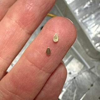 Hand-making the back of the gold settings to hold the diamonds in a Lilia Nash trilogy engagement ring