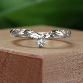 Platinum diamond solitaire wishbone wedding ring with pretty hand engraved leaves