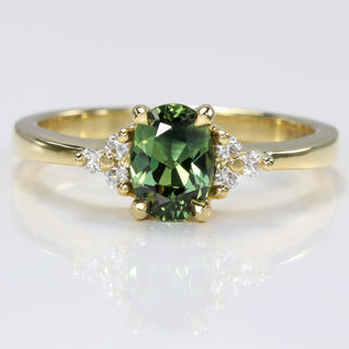 18ct yellow gold engagement ring with oval Parti sapphire and diamond clusters 