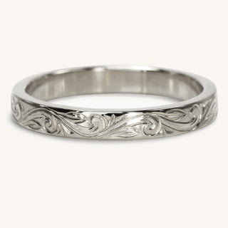Platinum 3mm wedding band with a hand engraved floral scroll pattern around the band