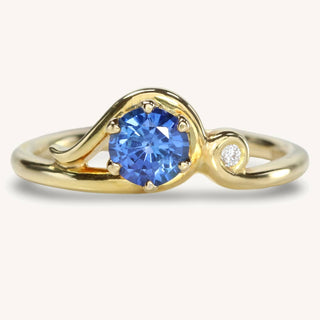 18ct gold Art Nouveau inspired sapphire engagement ring with Canadian diamond accent