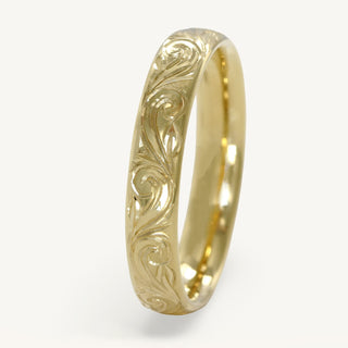 18ct gold wedding band in a 4mm court profile with hand engraved floral scroll pattern