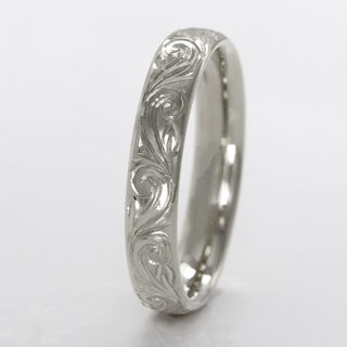 Platinum 4mm court wedding band with hand engraved floral scroll pattern