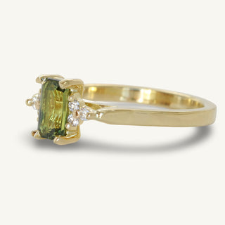 Side view of handmade 18ct gold fair trade radiant cut Parti sapphire and diamond cluster ring
