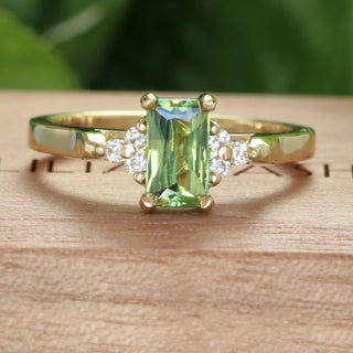 Handmade Radiant cut Parti sapphire and diamond cluster engagement ring in sustainable 18ct gold