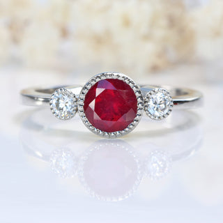 Trio of stones on platinum band showing ruby and diamonds