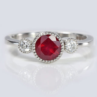 ruby and diamond trilogy engagement ring in platinum