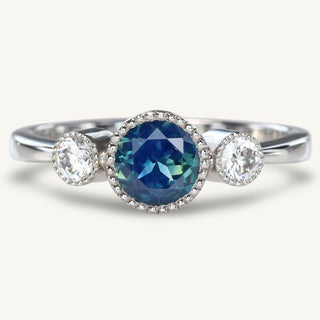 Handmade sustainable 950 Platinum trilogy engagement ring set with a natural fair trade Parti sapphire and natural white diamonds