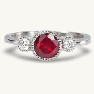 Handmade ruby and diamond trilogy engagement ring in platinum