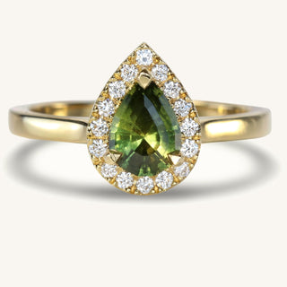 Handmade 18ct gold pear cut green sapphire engagement ring with a halo of natural fair trade white diamonds