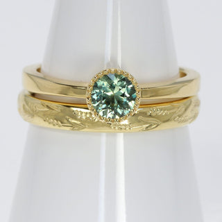 18ct gold green sapphire solitaire engagement ring and hand engraved lavender 3mm court wedding band