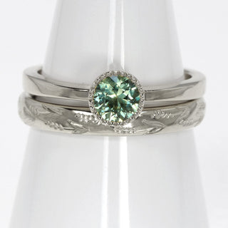 Platinum green sapphire solitaire engagement ring and hand engraved lavender 3mm court wedding band