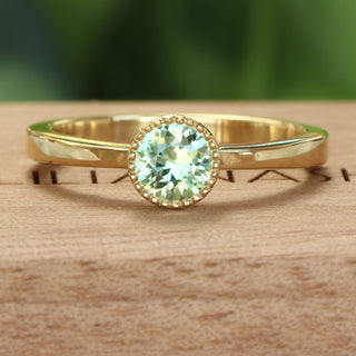 Pale green sapphire solitaire engagement ring, handmade in 18ct gold