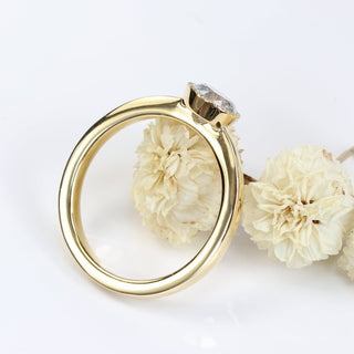 Side view of 18ct gold salt and pepper diamond solitaire ring with milgrain bezel.