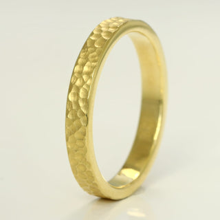 Marazion 18ct gold flat profile wedding band with a rippled sand effect texture applied by hand
