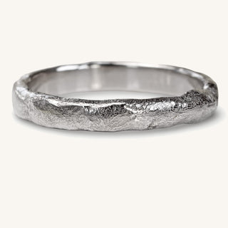 3mm wide platinum wedding band with a molten texture