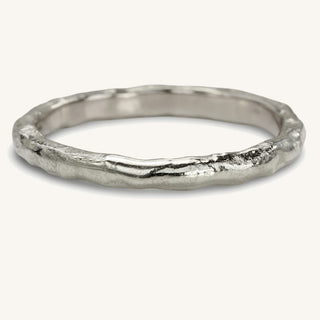 Slim 2mm 950 platinum wedding band with a molten texture