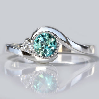 Parti sapphire platinum wave engagement ring, handmade by Lilia Nash